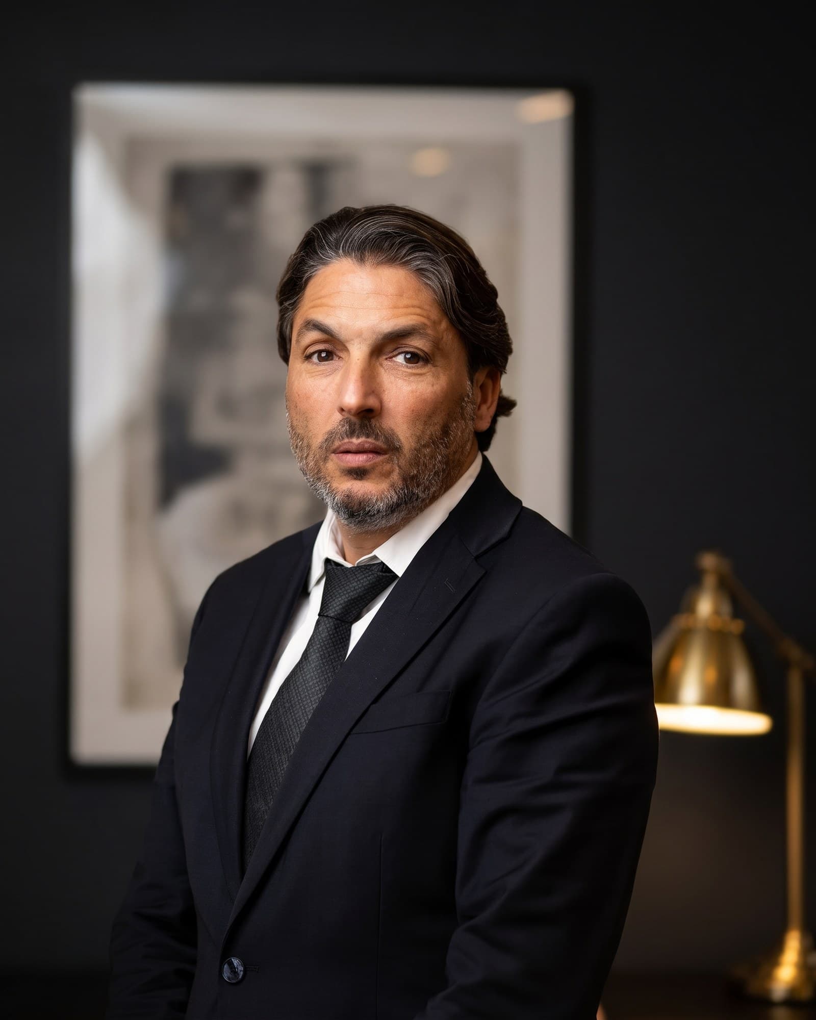 Adv. & CPA Shlomi Vaknin at his desk in his office